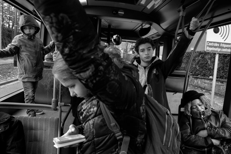 During one and a half year, I travelled with every bus, tram, and metro line at least once, from terminal to terminal.  Images and text show a cross-section of Brussels, while also  giving a brief glimpse into the lives of the) fellow passengers who cross our path every day. © Bram Penninckx